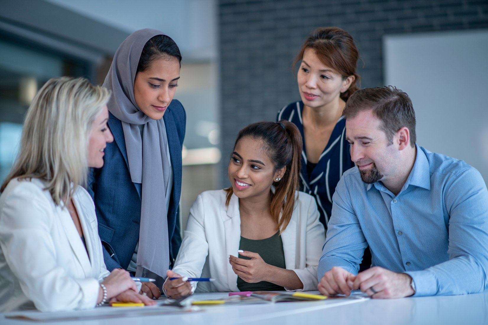 Diverse coworkers working together